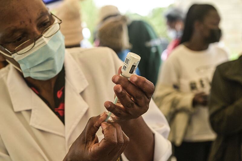 A healthcare worker prepares a dose of Moderna Covid-19 vaccine in Nairobi, Kenya. AFP