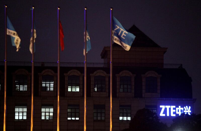 FILE - In this March 16, 2016, file photo, flags fly over the ZTE Global Cloud Computing Center in Nanjing in eastern China's Jiangsu province. Chinese tech company ZTE said late Sunday, May 6, 2018 it applied to the U.S. Commerce Department to suspend a seven-year ban on doing business with U.S. technology exporters. (Chinatopix via AP, File)