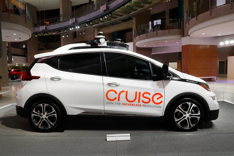 FILE - In this Jan. 16, 2019, file photo, Cruise AV, General Motor's autonomous electric Bolt EV is displayed in Detroit. General Motors' self-driving car company is sending vehicles without anybody behind the wheel in San Francisco as it navigates its way toward launching a robotic taxi service that would compete against Uber and Lyft in the hometown of the leading ride-hailing services. The move announced Wednesday, Dec. 9, 2020, by GM-owned Cruise come two months after the company received Californiaâ€™s permission to fully driverless cars in the state.  (AP Photo/Paul Sancya, File)