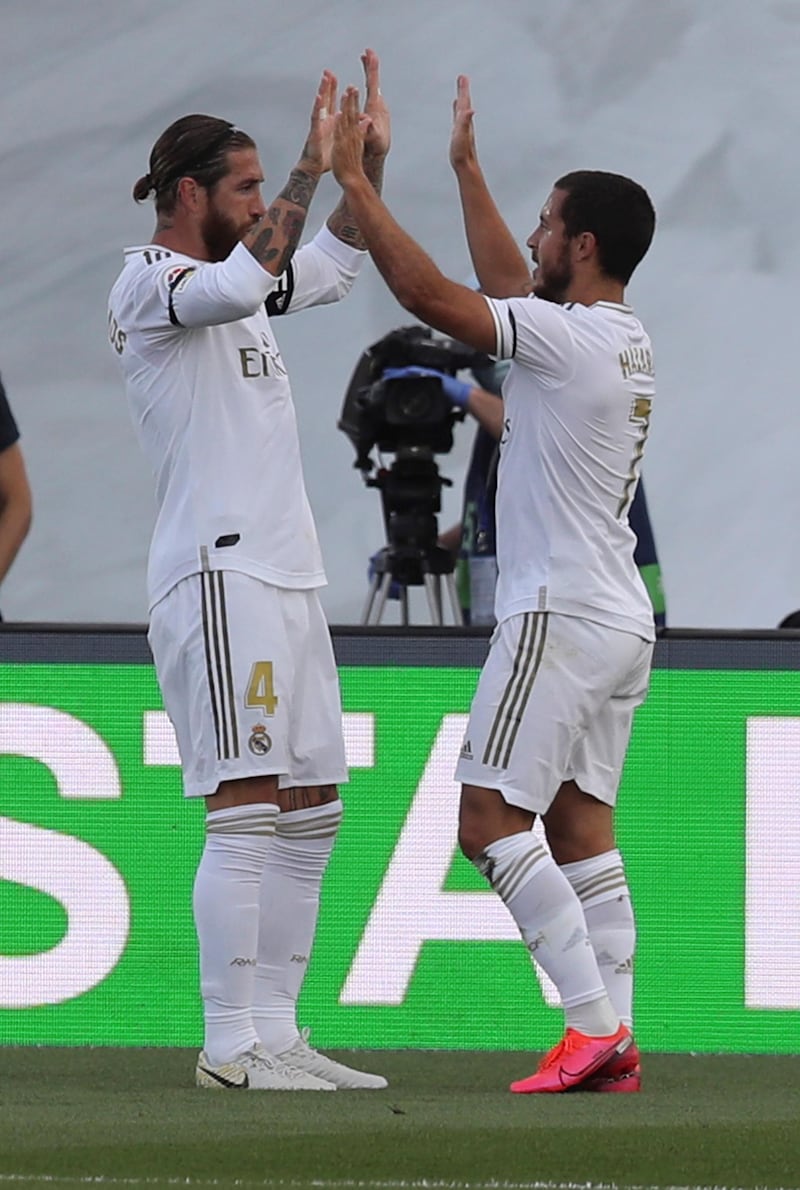 Sergio Ramos (L) celebrates with teammate Eden Hazard after scoring their second goal. EPA