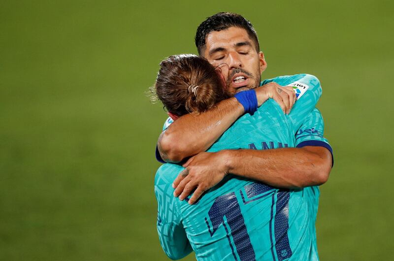 Barcelona's Antoine Griezmann celebrates scoring their third goal with Luis Suarez. Reuters