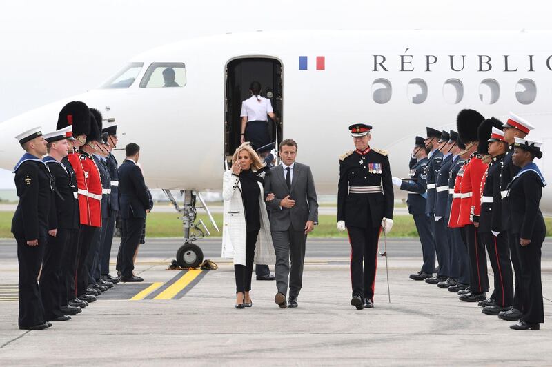 French President Emmanuel Macron and his wife Brigitte arrive at Cornwall Airport in Newquay. AP