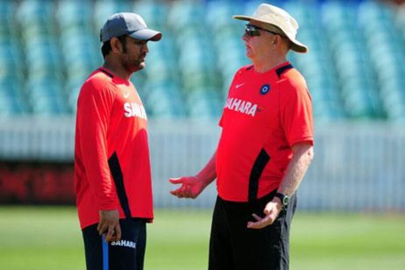 The India coach Duncan Fletcher, right, chats with captain MS Dhoni during a net session in Taunton, England.