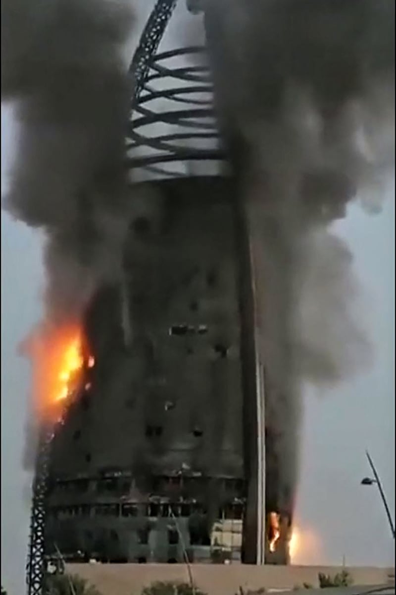 A grab from a UGC video posted on X, formerly Twitter, on September 17, 2023, shows a raging fire inside the Greater Nile Petroleum Oil Company Tower in Khartoum