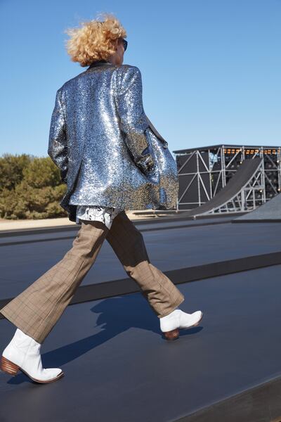 Mixing sequins with cowboy boots at the Celine spring / summer 2022 menswear show