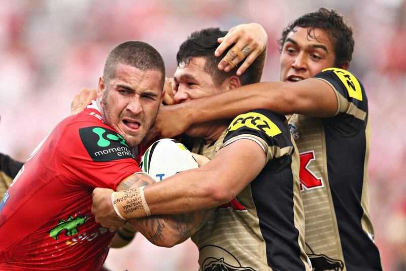 Joel Thompson of the Dragons is tackled by Tyrone Peachey and Te Maire Martin of the Panthers during the round four NRL match between the St George Illawarra Dragons and the Penrith Panthers at WIN Stadium in Sydney, Australia.  Mark Kolbe / Getty Images