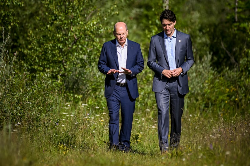 G7 leaders Olaf Scholz and Justin Trudeau talk a walk at Elmau Castle in Bavaria. EPA