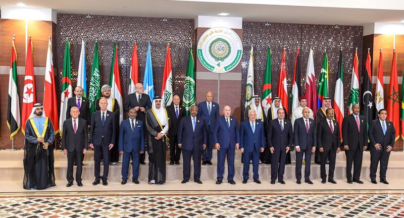 Arab leaders pose for a group photo during the summit. EPA