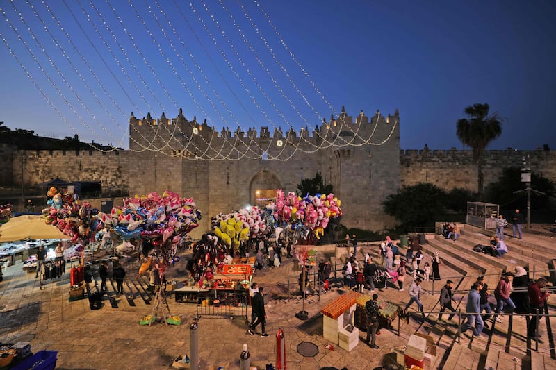 Balloons are displayed in front of the Damascus Gate in Jerusalem's Old City in the run-up to morning Eid Al Fitr prayers. AFP