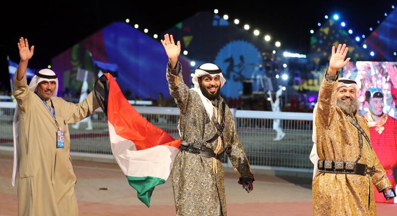 Representatives of UAE are led into the arena at the opening ceremony of the World Nomad Games. EPA