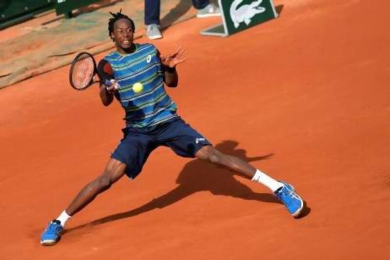 France's Gael Monfils returns to Czech Republic's Tomas Berdych during their first-round match. Miguel Medina / AFP