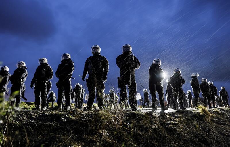 Police respond to protests at a lignite mine near the village of Luetzerath in Germany. EPA

