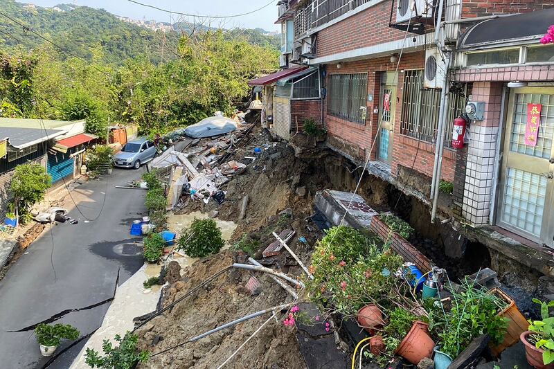 Buildings and homes damaged in Xindian district, New Taipei City. AFP