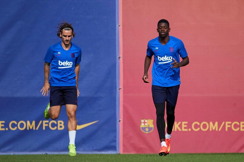 Barcelona's players Antoine Griezmann, left, and Ousmane Dembele during a training session at Joan Gamper Sports City in Barcelona ahead of Wednesday's Champions League match against Inter Milan. AFP