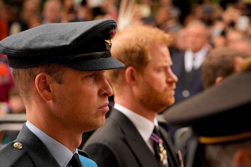 Prince William and Prince Harry follow the coffin of the queen after her state funeral in Westminster Abbey. AP