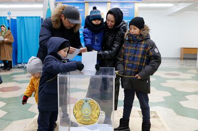 A family at a polling station in Astana, Kazakhstan, on Sunday. AP