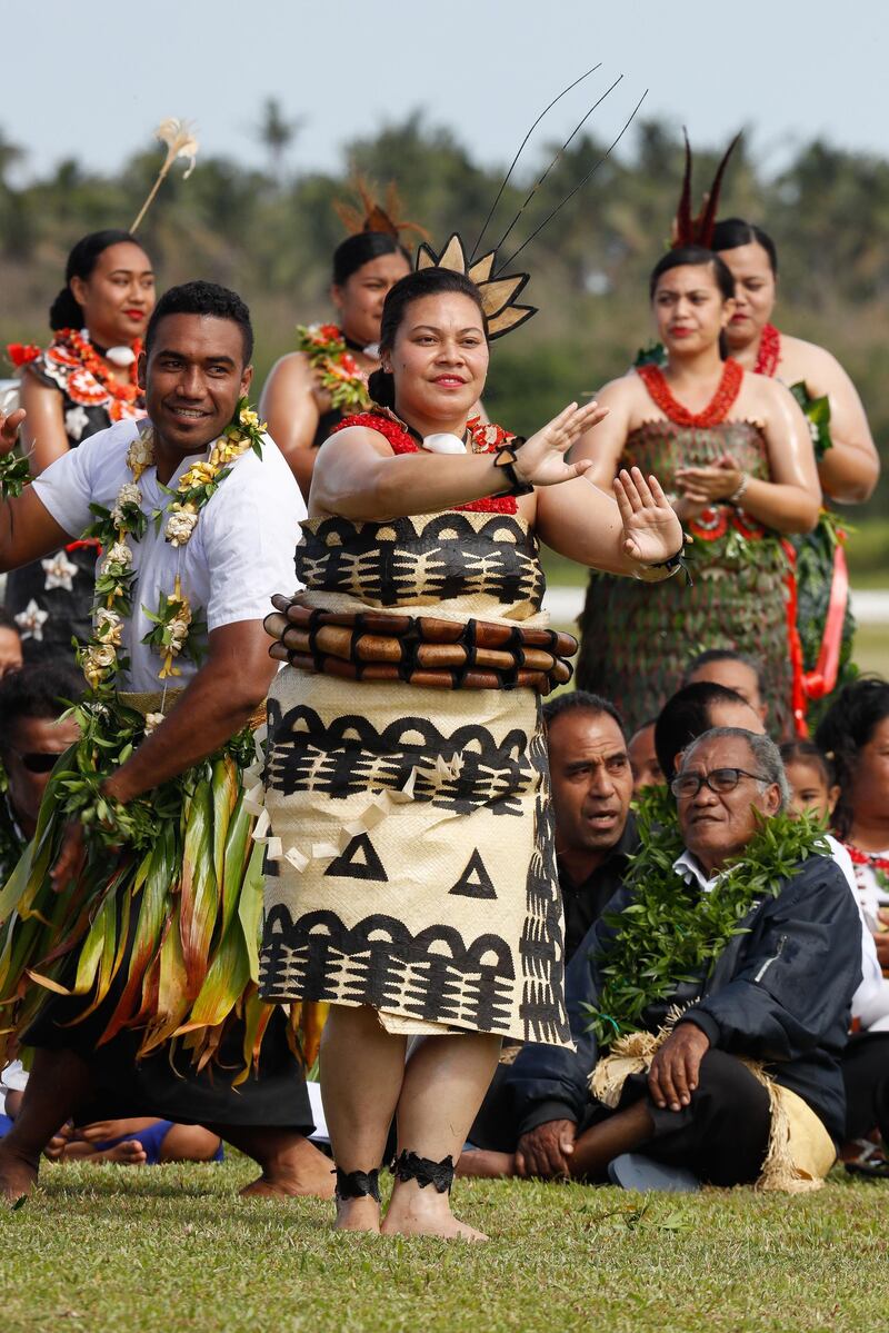 Dancers greet Meghan and Harry in Tonga. Getty Images