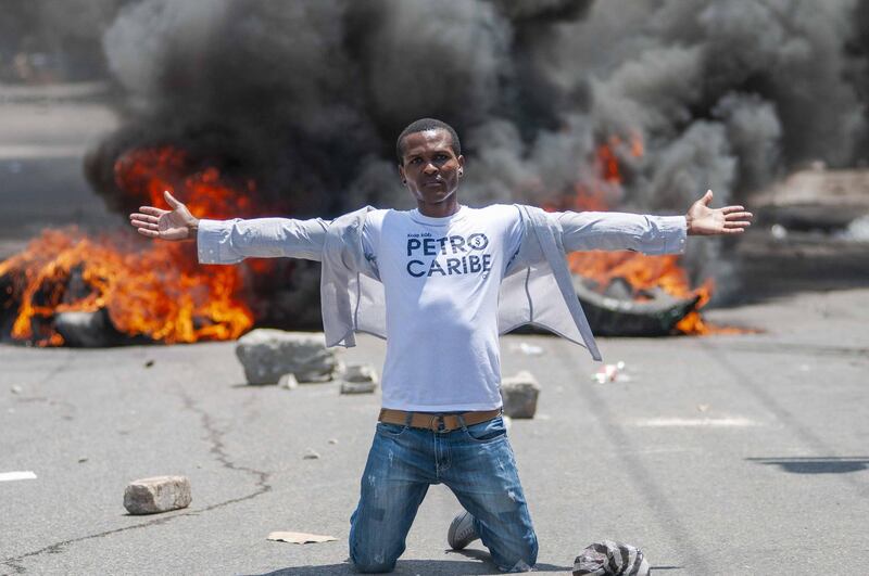 A man participates in an anti-corruption march in Port-au-Prince, Haiti. Jean Marc Herve Abelard / EPA