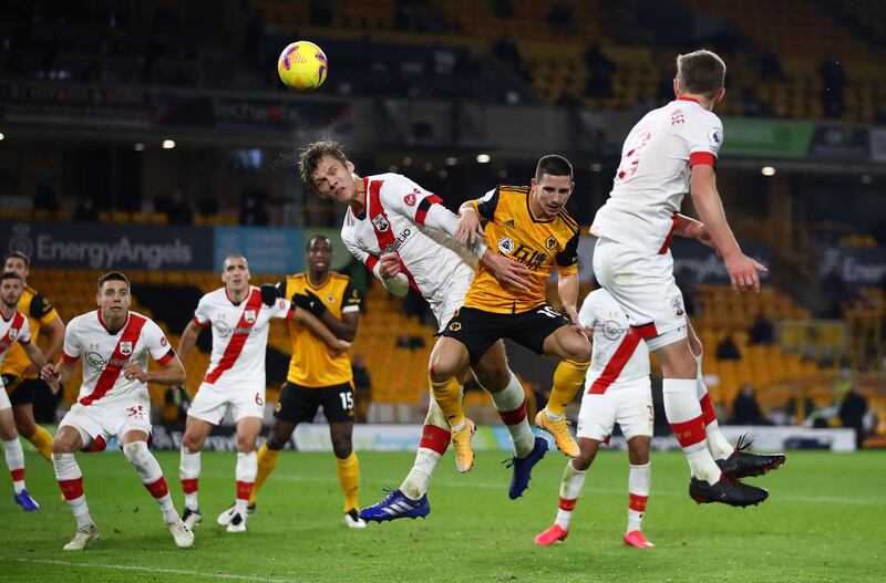 Southampton's Jannik Vestergaard heads clear from Wolverhampton Wanderers' Daniel Podence. PA