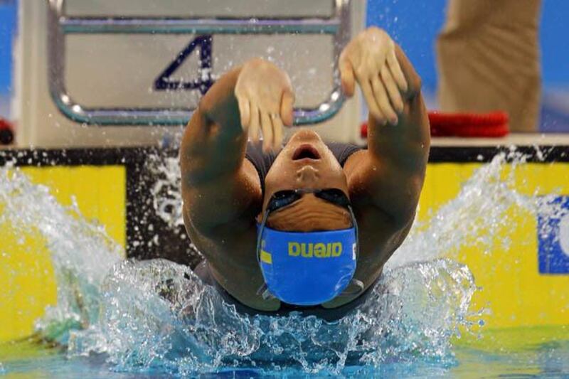 epa02956665 Daryna Zevina of Ukraine is on her way to win the women's 100m Backstroke final during the FINA/ARENA Swimming World Cup 2011 at Hamdan bin Mohammed bin Rashid Sports Complex in Dubai, United Arab Emirates, 08 October 2011.  EPA/ALI HAIDER