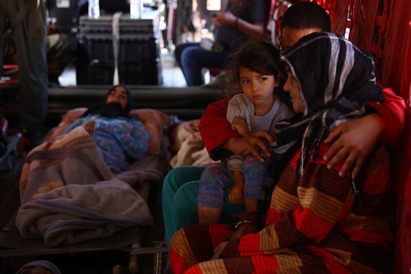 A girl waits to be airlifted to hospital by military helicopter in Talat N'Yaaqoub. Reuters