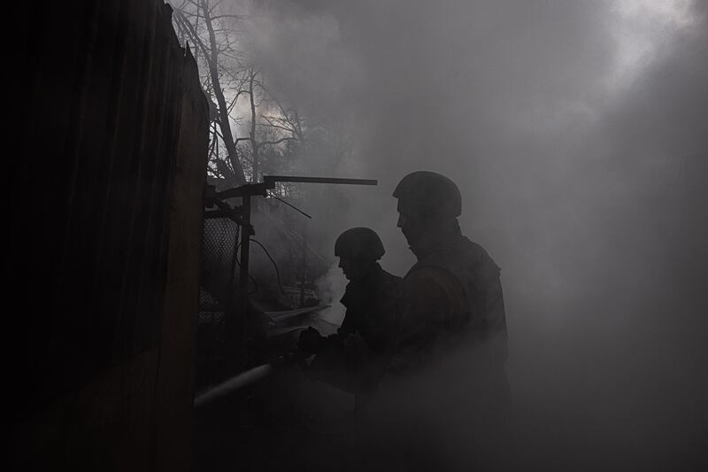 Firefighters at work on the outskirts of Kharkiv, north-east Ukraine. EPA