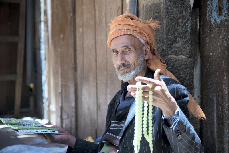 Mohammed, Yemen: Mohammed takes an image of an old man selling rotary beads in Souq Al Melh,The Salt Market, in the Yemeni capital of Sana’a.