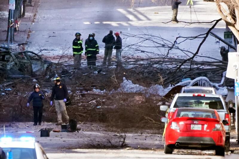 Investigators work at the scene of an explosion in Nashville, Tenn. The explosion that shook the largely deserted streets of downtown Nashville early Christmas morning shattered windows, damaged buildings and wounded three people. Authorities said they believed the blast was intentional.  AP