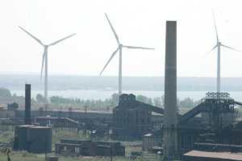 Wind turbines slowly spin on the Lake Erie waterfront in Lackawanna, N.Y., Thursday, June 7, 2007. The unique "urban" wind farm has sprouted along a stretch of Lake Erie that is too polluted for much else. Eight towering turbines slowly spin on a waterfront site where Bethlehem Steel once stood. (AP Photo/David Duprey)