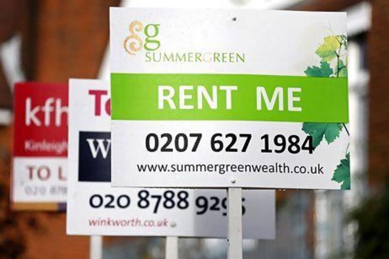 Signs advertising properties for rent in Roehampton, London. Simon Dawson / Bloomberg News