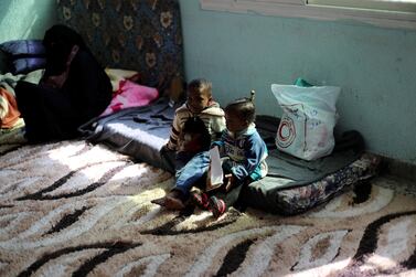 A displaced family, forced to flee their home because of fighting in Tripoli, taking shelter at a school. Ahmed Jadallah / Reuters