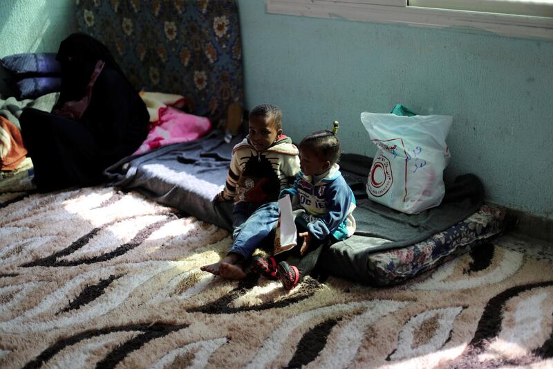 Libyan displaced family members, who fled their house because of the fighting between the Eastern forces commanded by Khalifa Haftar and Internationally recognised government, sit at Bader School, which is used as a shelter, in Tripoli, Libya April 14, 2019. REUTERS/Ahmed Jadallah