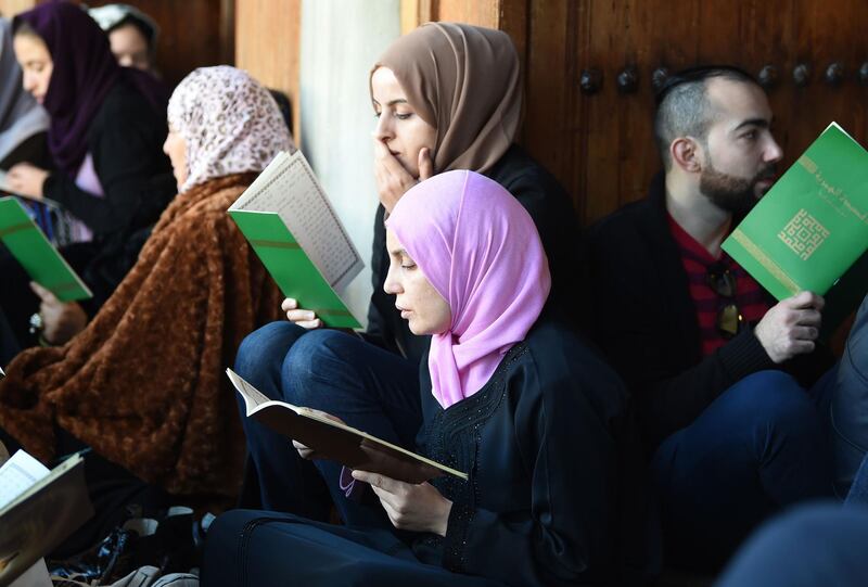 Muslims read verses in the praise of Prophet Mohammed as they celebrate the birthday of Islam's prophet, at the historic Zaituna mosque in Tunis, Tunisia. AFP