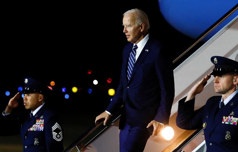 US President Joe Biden disembarks Air Force One. Reuters