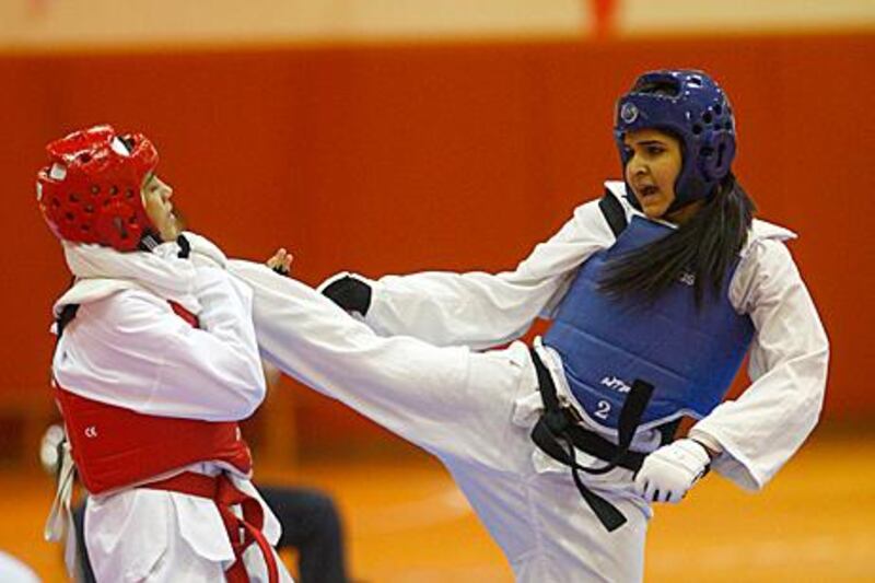 Participants in the Women’s Taekwondo Championship, from the UAE, Oman and Bahrain, noted that the sport is empowering. Mike Young / The National