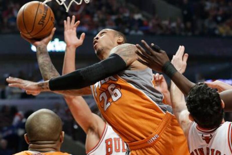 Phoenix's Shannon Brown drives to the basket against the Chicago defence.