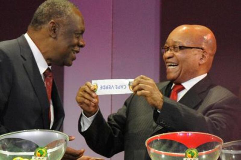 South African president Jacob Suma jokes with Issa Hayatou during the draw for the African Cup of Nations