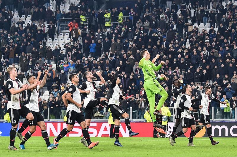 Juventus players celebrate after their victory over Atletico Madrid. AFP