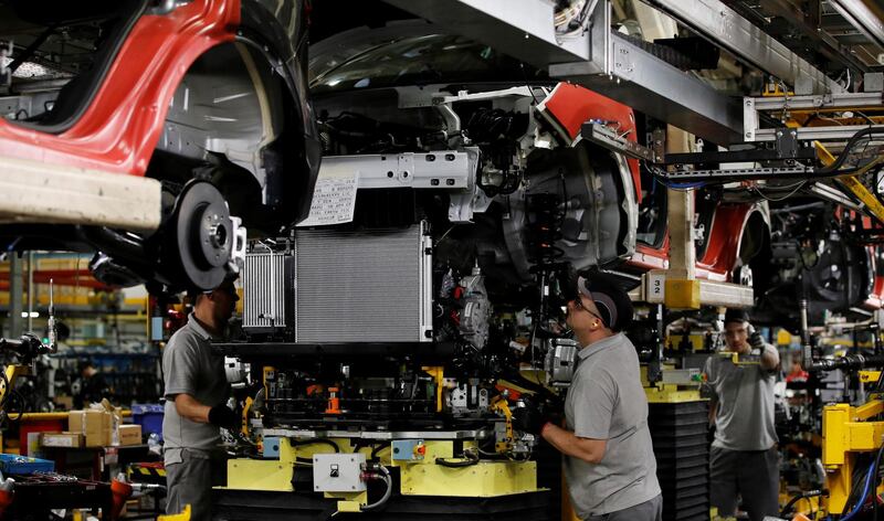 Workers are seen on the production line at Nissan's car plant in Sunderland Britain, October 10, 2019. REUTERS/Phil Noble