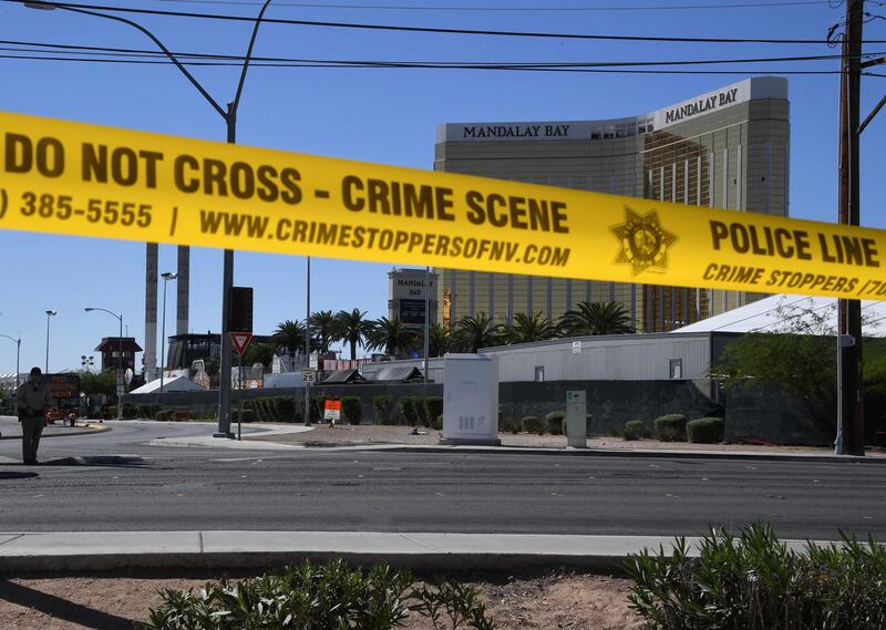 The damaged windows on the 32nd floor room that was used by the shooter in the Mandalay Hotel and the Route 91 festival venue (front) after a gunman killed more than 58 people and wounded more than 500 others when he opened fire on a country music festival in Las Vegas, Nevada on October 2, 2017.  Mark Ralston / AFP