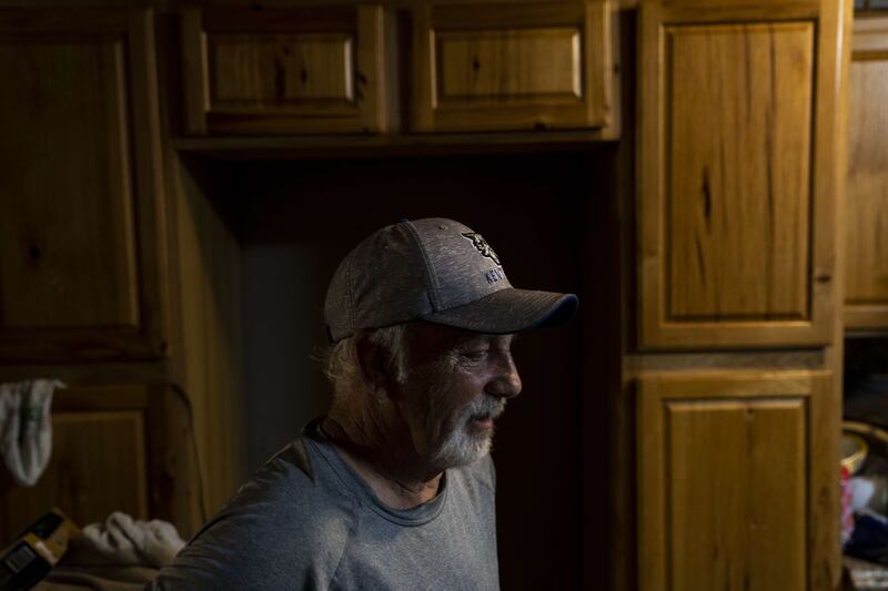 Fred Neace overlooks his bare kitchen floor after the boards were torn up following flood damage near Hazard, Kentucky.  Getty Images. Getty Images / AFP

