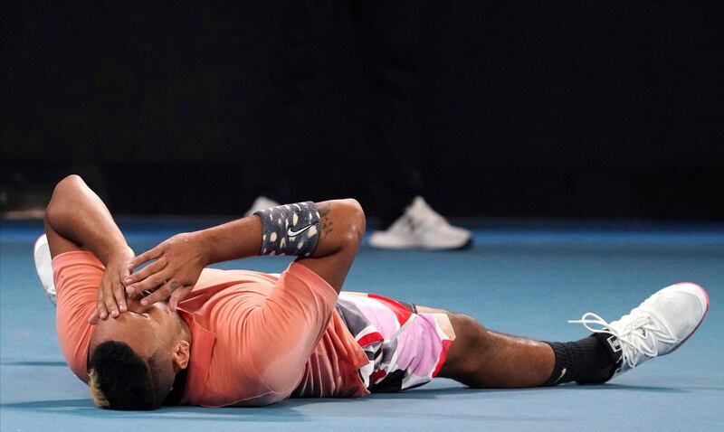 Australia's Nick Kyrgios lies down on the court after defeating Russia's Karen Khachanov in their third round singles match at the Australian Open tennis championship in Melbourne, Australia, Saturday, Jan. 25, 2020. (AP Photo/Lee Jin-man)