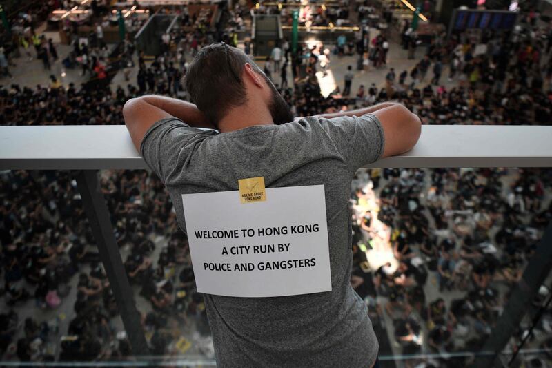 A man looks out from the departures area. AFP