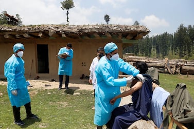 A healthcare worker gives a dose of COVISHIELD, a coronavirus vaccine manufactured by Serum Institute of India, to a shepherd during a vaccination drive at a forest area in south Kashmir's Pulwama district. Reuters