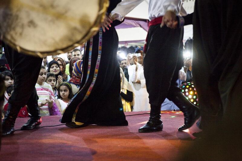 Audiences watch a traditional Jordanian Dabke Dance show at the Jordanian Pavilion. Razan Alzayani / The National