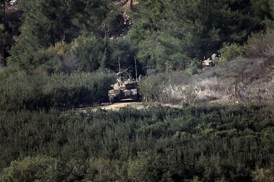 An Israeli tank advances on a road in northern Israel near the border with Lebanon on October 28, 2023, amid intensifying cross-border skirmishes. AFP