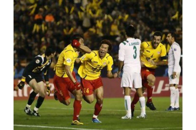 Seongnam players celebrate a goal against Iran’s Zob Ahan in the Asian Champions League final.