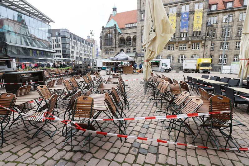 Empty tables and chairs are cordoned off outside a downtown restaurant during the lockdown in Chemnitz, Germany. AP Photo