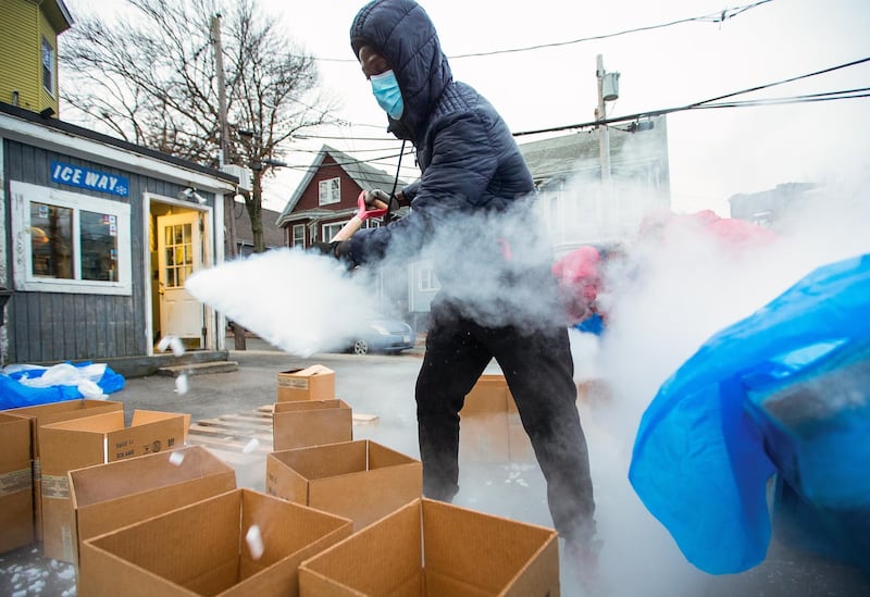 A crew member at the Acme Dry Ice Company shovels pellets of -109F (-78.5C) dry ice or CO2, into packaging for clients in North America at the company facilities in Cambridge, Massachusetts, US. EPA