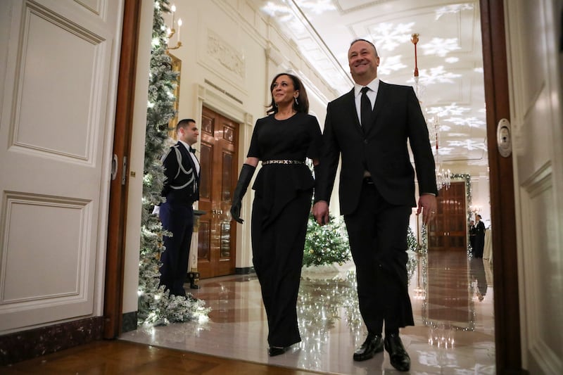 US Vice President Kamala Harris, wearing black Vera Wang, and her husband Doug Emhoff arrive for a reception for the Kennedy Centre honourees at the White House. Reuters 